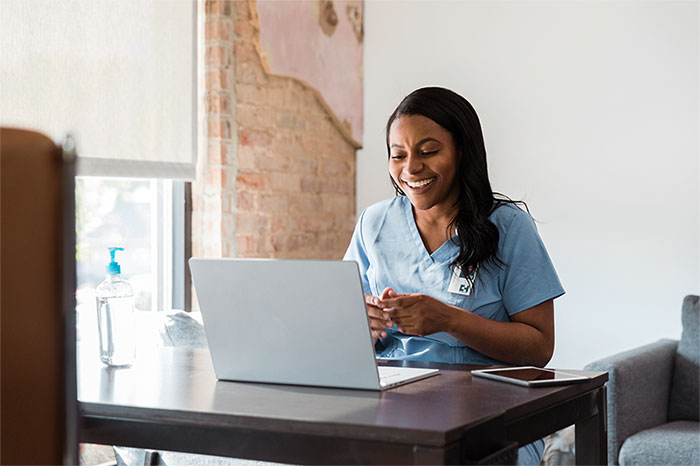 Nurse using laptop computer