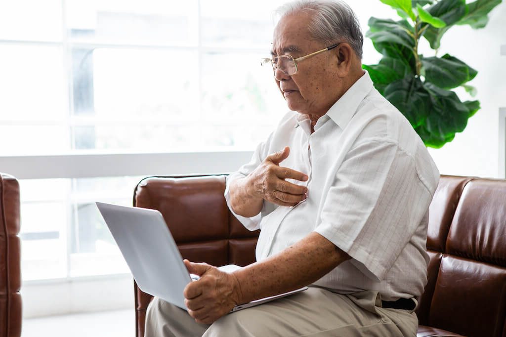 Man using laptop to center himself