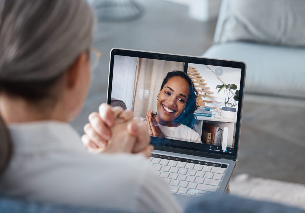 A medical professional on an online consultation with a patient