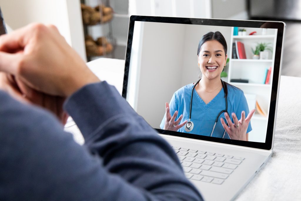 Patient at home while on video conference call with clinician